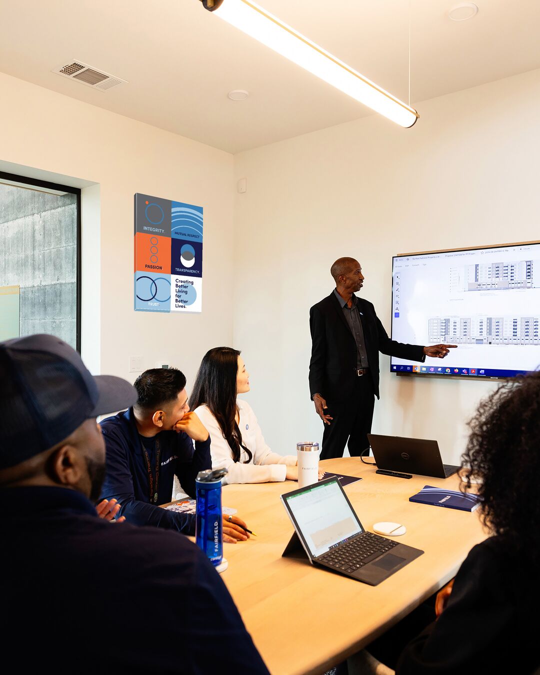 A Fairfield associate presents to a group of people