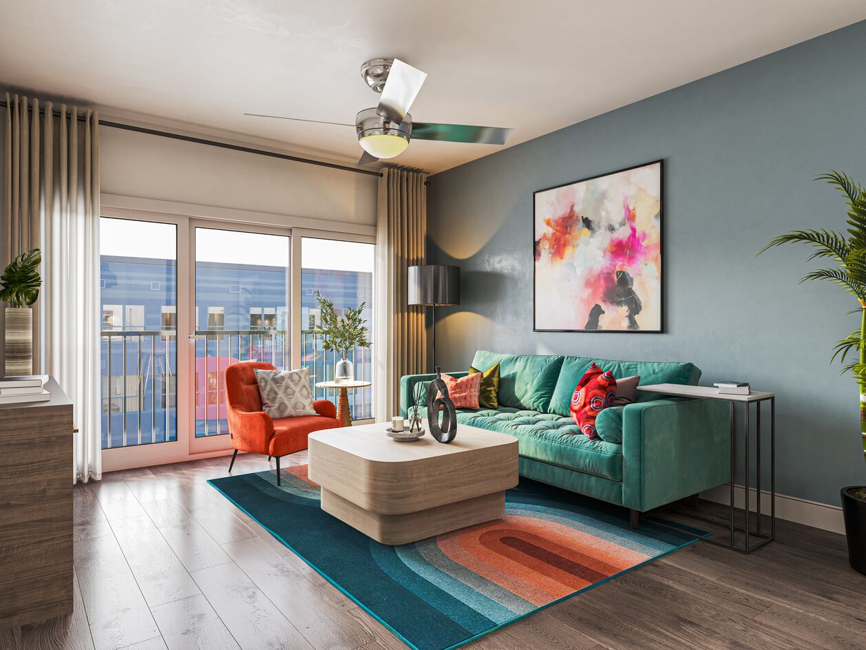 Colorful living room with patio at V2 Apartments in Chelsea, MA